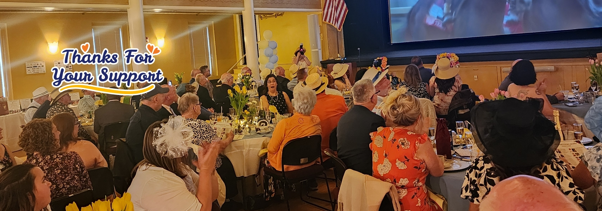 Well-dressed crowd at Kentucky Derby Social event